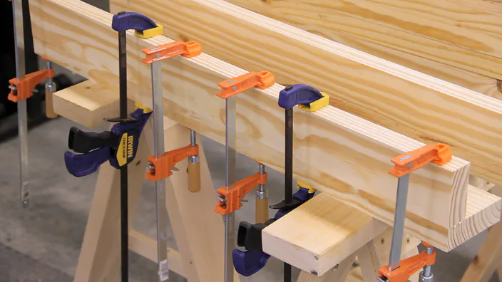 A planer is used to surface a piece of lumber.