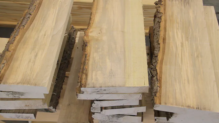 Three stacks of wooden boards.