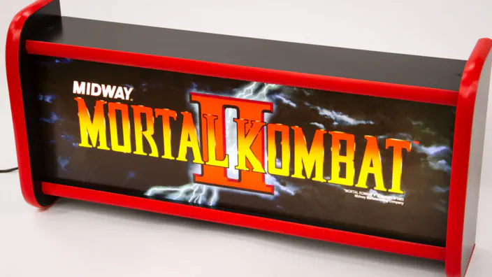 A Mortal Kombat 2 arcade marquee lightbox.