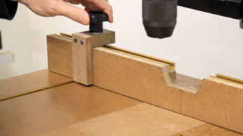 A drill press table and stop block.