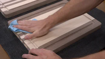 An unfinished edge grain cutting board.