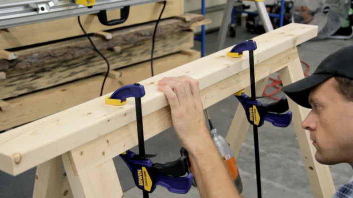 The folding sawhorse top is attached with screws.