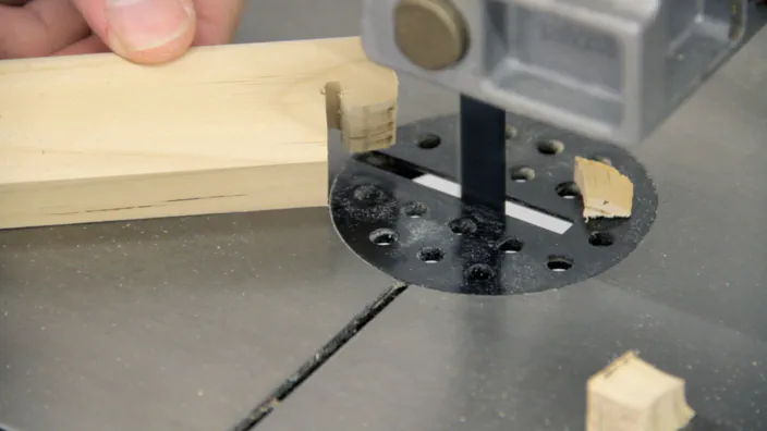 A band saw is used to cut a notch.