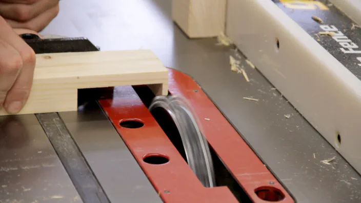 A table saw dado blade is used to cut the second half of a lap joint.
