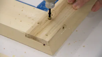 Screws are inserted into the lap joint.
