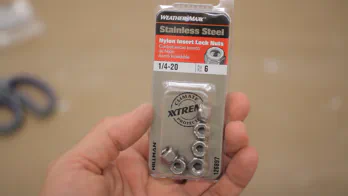 A pack of stainless steel nylon locking nuts.