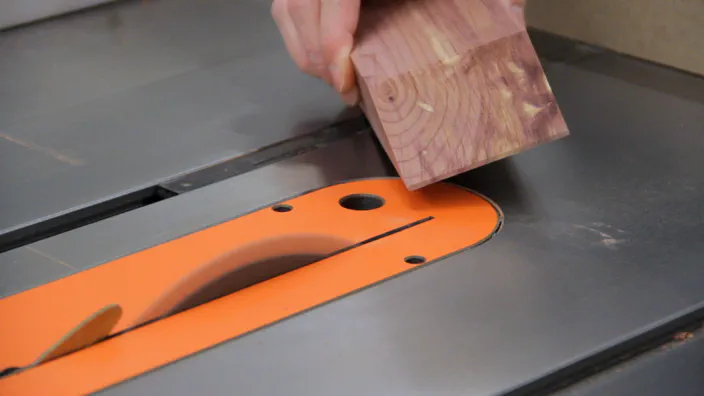 A table saw is used to cut a lip on each part.