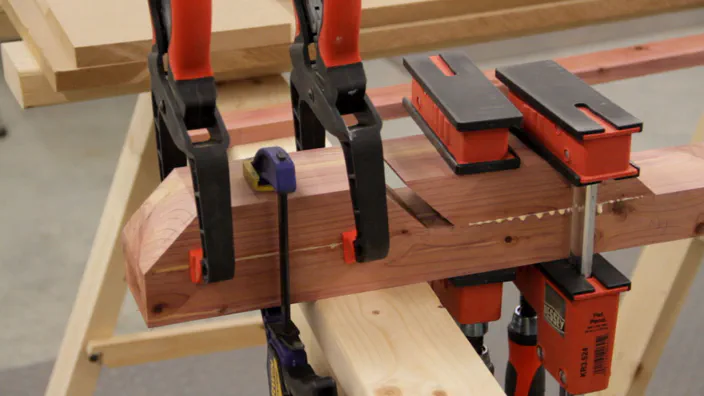Clamps are used to glue the front pieces of cedar to the back piece.