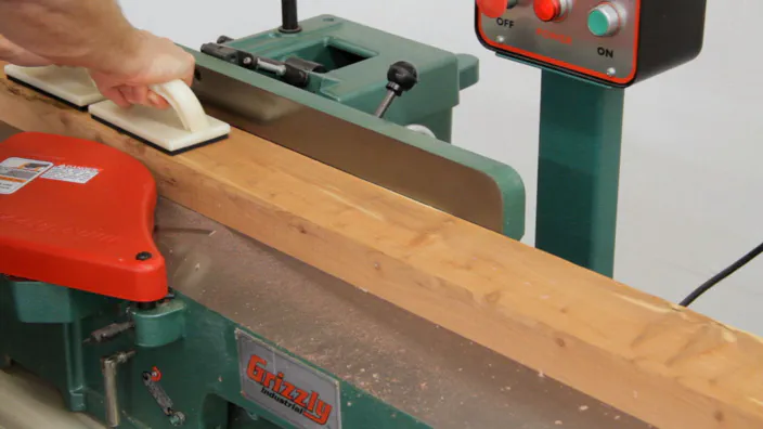 A jointer is used to join a cedar board.