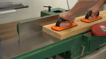Surfacing a board on a jointer.