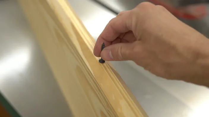 A screw is placed on the guide rail.