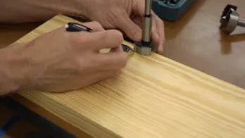 A miter saw trims the guide rail.