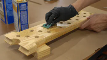 A miter saw trims the guide rail.