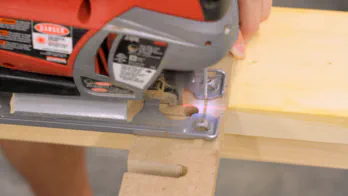 A jigsaw is used to cut slots in the top of the rack.