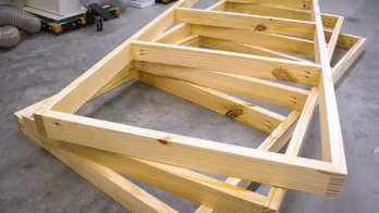 A set of 3 wooden frames.