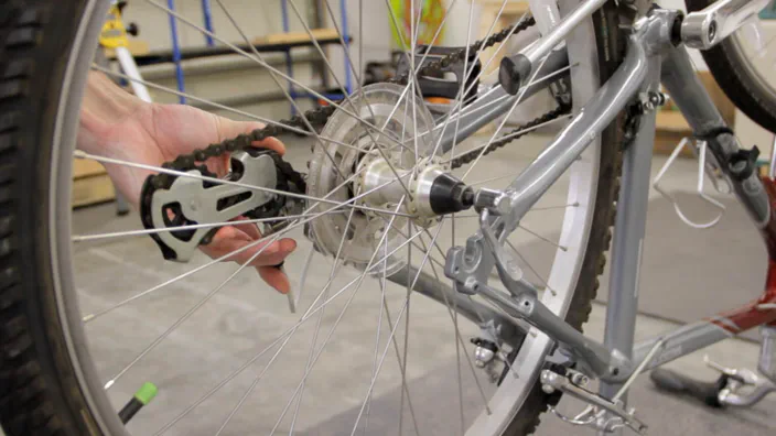 Removing a rear bicycle wheel.