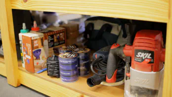 Glue tools, a router, and a sander.